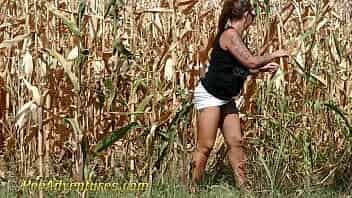 Chubby girl really needs to empty her bladder so she went into a corn field and pee with a big jet. PA211 video